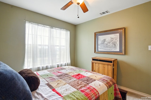 bedroom featuring baseboards, carpet, and a ceiling fan