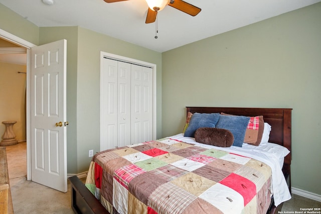 carpeted bedroom featuring a closet, a ceiling fan, and baseboards