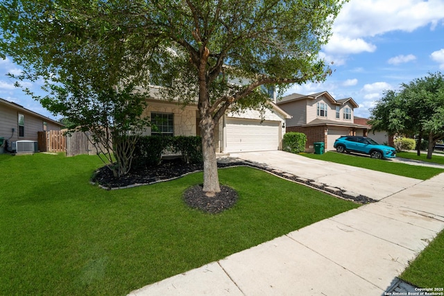 view of front facade with driveway, central AC unit, and a garage