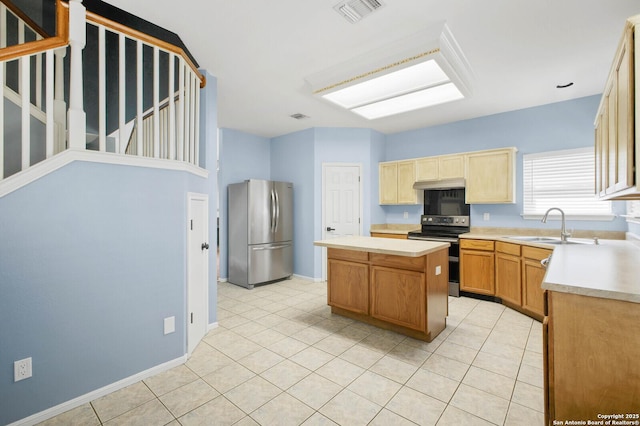 8818 Sarasota Woods, San Antonio, TX 78250 - kitchen featuring appliances with stainless steel finishes, a sink, a center island, and light countertops