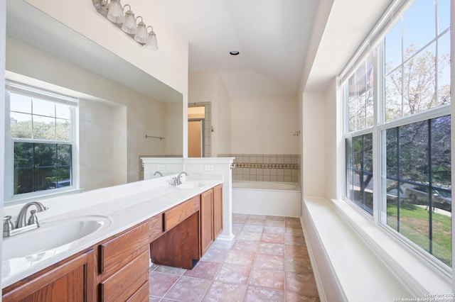 8818 Sarasota Woods, San Antonio, TX 78250 - full bath featuring a bath, double vanity, vaulted ceiling, and tile patterned flooring