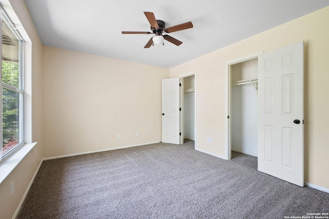 8818 Sarasota Woods, San Antonio, TX 78250 - unfurnished bedroom with carpet flooring, baseboards, two closets, and a ceiling fan