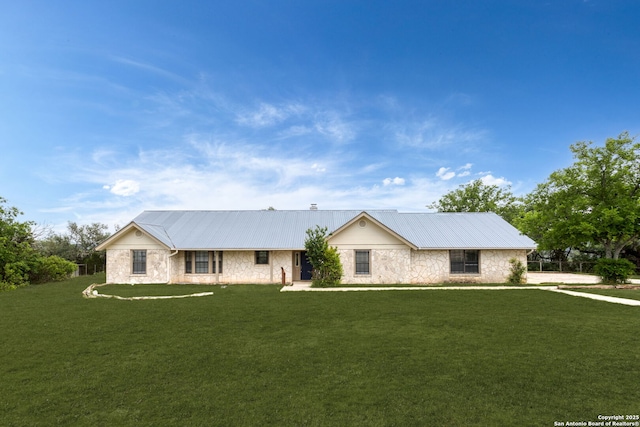 3010 Skyline, Canyon Lake, TX 78133 - ranch-style house featuring stone siding, a front yard, and metal roof