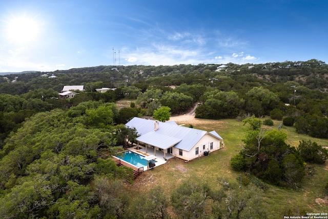 3010 Skyline, Canyon Lake, TX 78133 - view of subject property with a pool area and a heavily wooded area