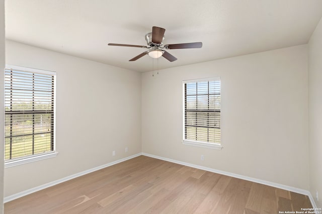 3010 Skyline, Canyon Lake, TX 78133 - unfurnished room featuring light wood-style floors, baseboards, and a ceiling fan