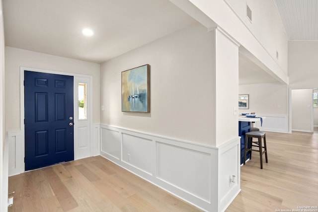 3010 Skyline, Canyon Lake, TX 78133 - foyer featuring light wood-type flooring, wainscoting, and a decorative wall