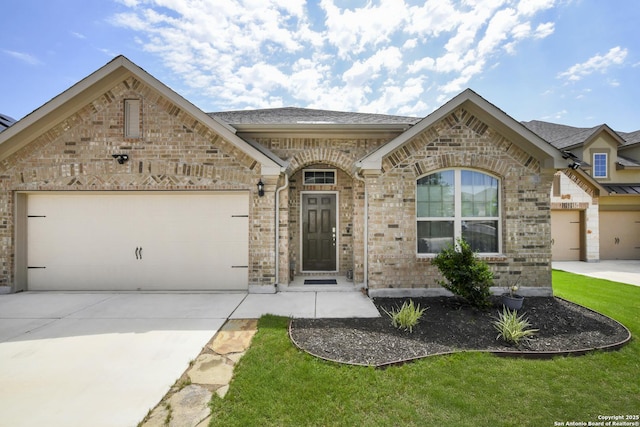 1710 Briar Spg, San Antonio, TX 78245 - french country style house featuring driveway, brick siding, and an attached garage