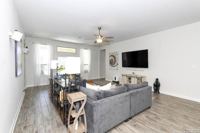 1710 Briar Spg, San Antonio, TX 78245 - living area with baseboards, light wood-style flooring, and ceiling fan