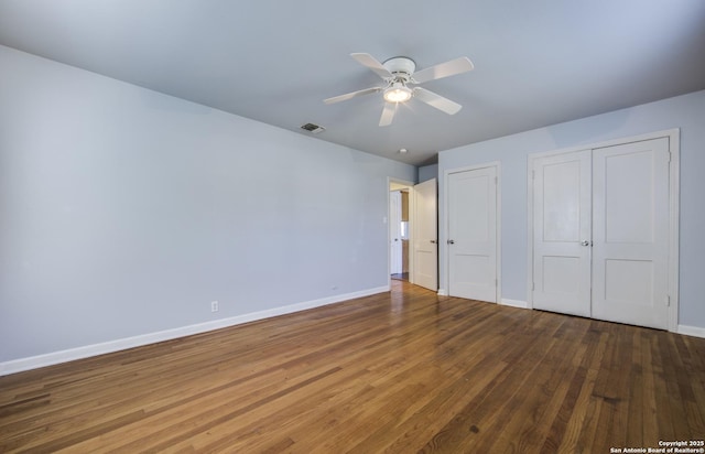 314 Gazel, San Antonio, TX 78213 - unfurnished bedroom featuring baseboards, wood finished floors, multiple closets, and ceiling fan