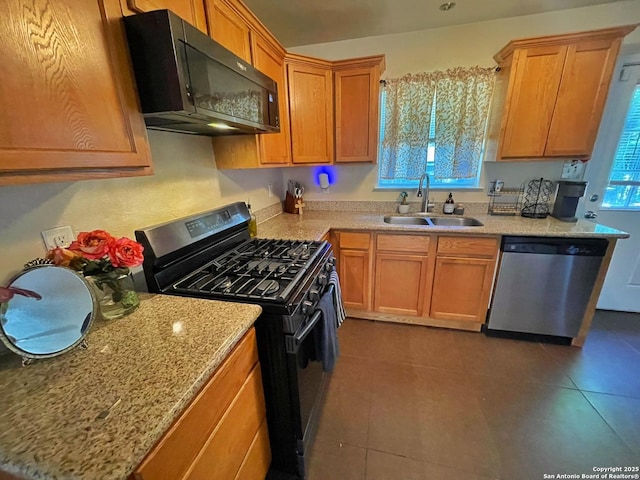 314 Gazel, San Antonio, TX 78213 - kitchen featuring black appliances, a sink, dark tile patterned floors, and light stone counters