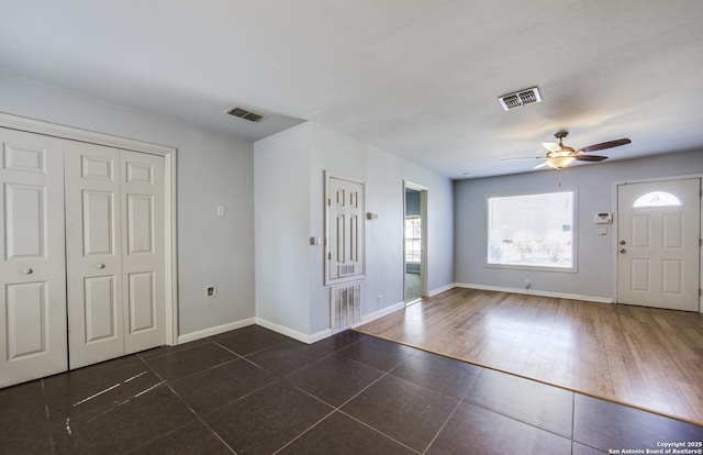 314 Gazel, San Antonio, TX 78213 - entrance foyer with a ceiling fan, dark tile patterned floors, and baseboards