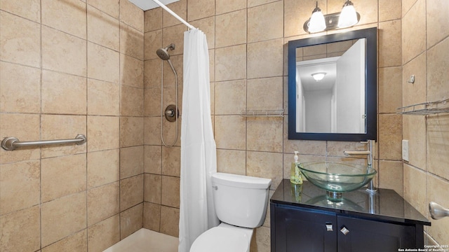 4722 Casa Manana, San Antonio, TX 78233 - bathroom with a stall shower, tile walls, vanity, and toilet