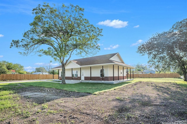 1615 N Guadalupe, Seguin, TX 78155 - rear view of house with brick siding, roof with shingles, and covered porch