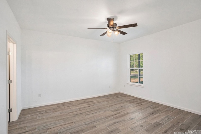 1615 N Guadalupe, Seguin, TX 78155 - unfurnished room with wood finished floors, ceiling fan, and baseboards