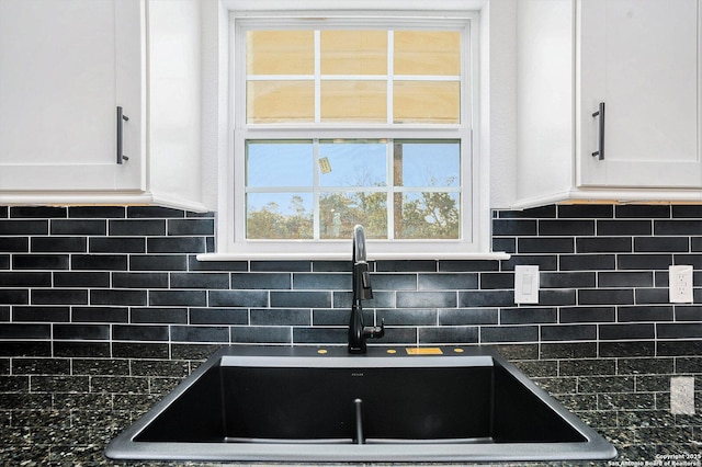 1615 N Guadalupe, Seguin, TX 78155 - kitchen with a sink, dark countertops, white cabinetry, and tasteful backsplash