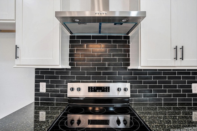 1615 N Guadalupe, Seguin, TX 78155 - kitchen with range hood, stainless steel electric range, white cabinetry, and tasteful backsplash