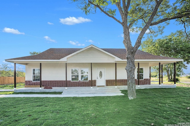 1615 N Guadalupe, Seguin, TX 78155 - view of front of house featuring brick siding, covered porch, and roof with shingles