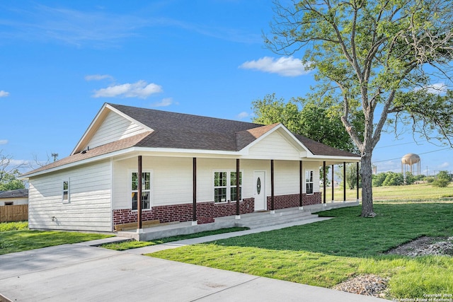 1615 N Guadalupe, Seguin, TX 78155 - view of front of property with covered porch, brick siding, and a front yard