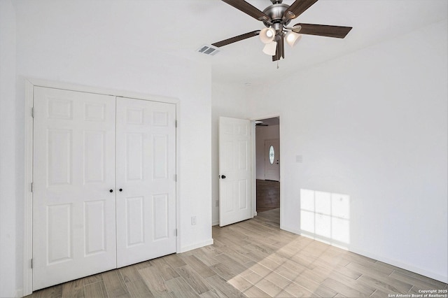 1615 N Guadalupe, Seguin, TX 78155 - unfurnished bedroom featuring a closet, light wood finished floors, ceiling fan, and baseboards