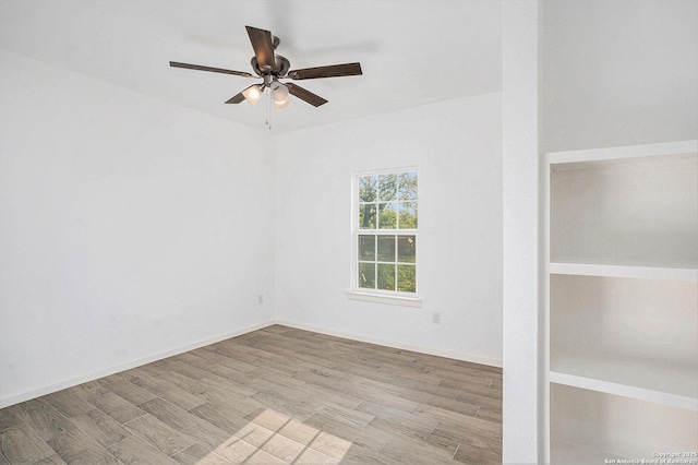 1615 N Guadalupe, Seguin, TX 78155 - spare room with ceiling fan and wood finished floors