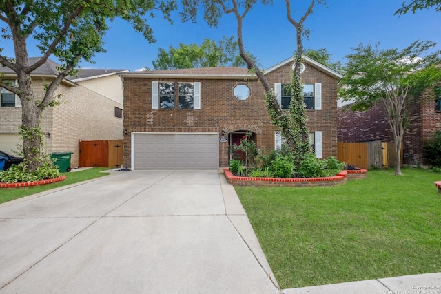 traditional-style home with an attached garage, driveway, brick siding, and a gate