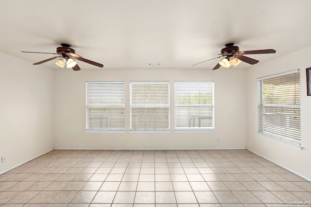 3601 Diamond Fls, Schertz, TX 78154 - empty room with ceiling fan, light tile patterned flooring, and baseboards