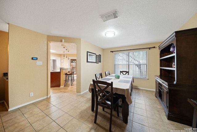 934 Saxonhill, San Antonio, TX 78253 - dining room with light tile patterned floors, baseboards, and a textured ceiling