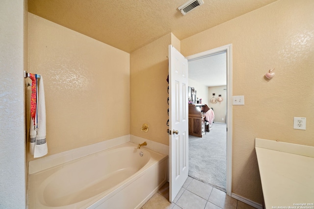 934 Saxonhill, San Antonio, TX 78253 - full bathroom featuring a garden tub, tile patterned flooring, and a textured wall