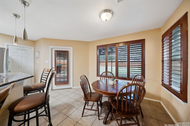 934 Saxonhill, San Antonio, TX 78253 - dining area featuring healthy amount of natural light, light tile patterned flooring, and baseboards