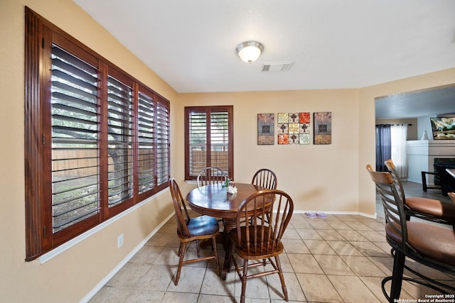 934 Saxonhill, San Antonio, TX 78253 - dining space featuring baseboards, a fireplace, and light tile patterned floors