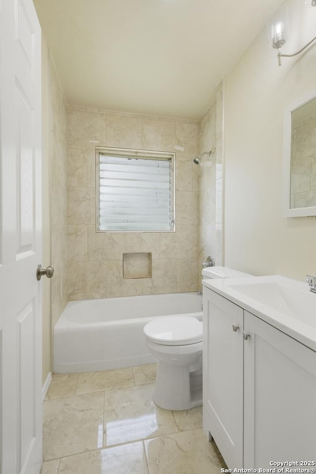6711 Greencastle, San Antonio, TX 78242 - bathroom with washtub / shower combination, toilet, vanity, and marble finish floors