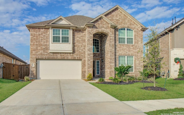 7606 Cottonwood Fls, Spring, TX 77379 - traditional home with a garage, brick siding, driveway, and roof with shingles