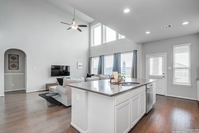 7606 Cottonwood Fls, Spring, TX 77379 - kitchen featuring dishwasher, a sink, dark wood-type flooring, a ceiling fan, and high vaulted ceiling