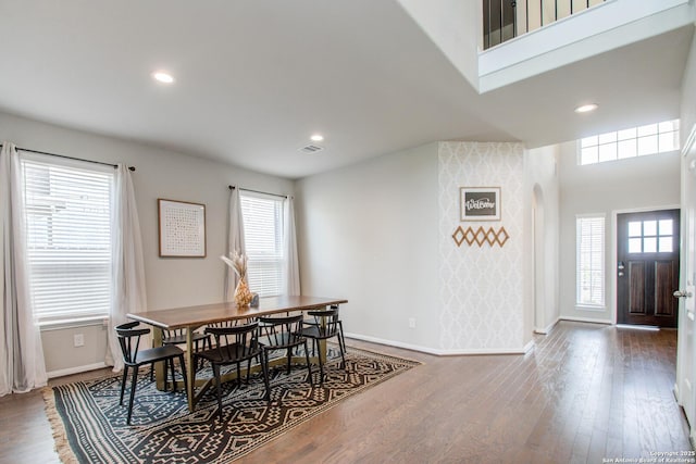 7606 Cottonwood Fls, Spring, TX 77379 - dining area with arched walkways, baseboards, wood finished floors, and recessed lighting