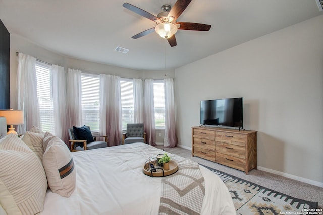 7606 Cottonwood Fls, Spring, TX 77379 - bedroom with baseboards, light colored carpet, and a ceiling fan
