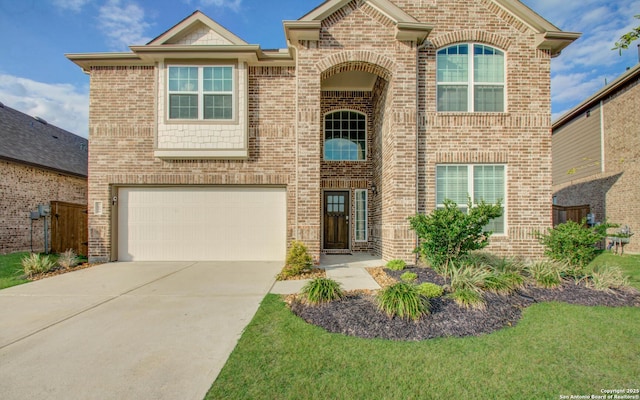 7606 Cottonwood Fls, Spring, TX 77379 - view of front of home with a garage, concrete driveway, and brick siding