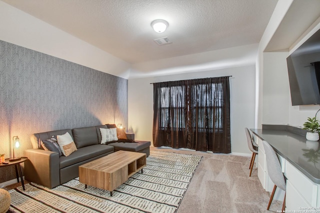 7606 Cottonwood Fls, Spring, TX 77379 - carpeted living room with baseboards and a textured ceiling