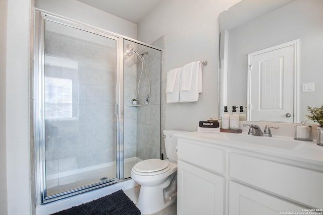 7606 Cottonwood Fls, Spring, TX 77379 - bathroom featuring a stall shower, toilet, and vanity