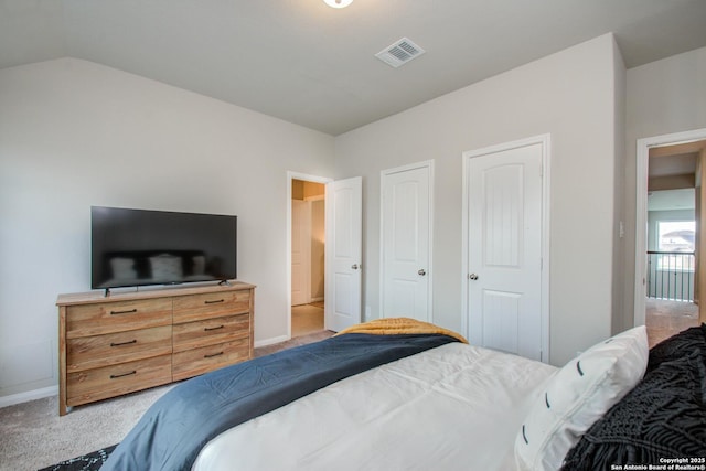 7606 Cottonwood Fls, Spring, TX 77379 - bedroom featuring carpet, baseboards, vaulted ceiling, and multiple closets
