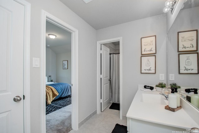 7606 Cottonwood Fls, Spring, TX 77379 - ensuite bathroom with vanity and tile patterned flooring