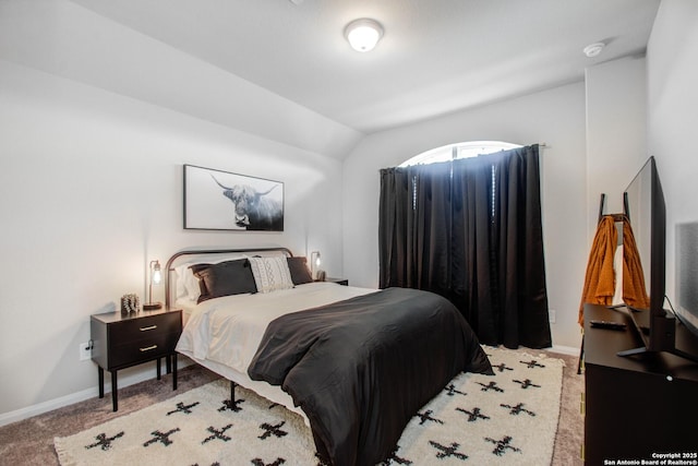7606 Cottonwood Fls, Spring, TX 77379 - bedroom featuring lofted ceiling, baseboards, and light colored carpet