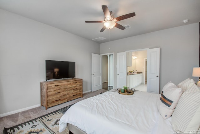 7606 Cottonwood Fls, Spring, TX 77379 - bedroom with light colored carpet, baseboards, ceiling fan, and ensuite bath