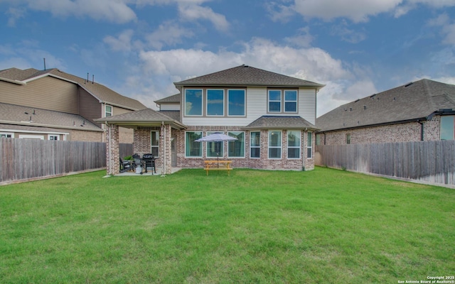 7606 Cottonwood Fls, Spring, TX 77379 - back of house featuring a patio, brick siding, and roof with shingles