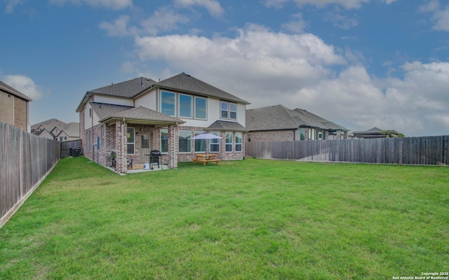 7606 Cottonwood Fls, Spring, TX 77379 - rear view of house featuring brick siding, a patio area, and roof with shingles