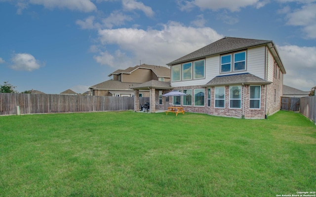 7606 Cottonwood Fls, Spring, TX 77379 - back of house featuring brick siding