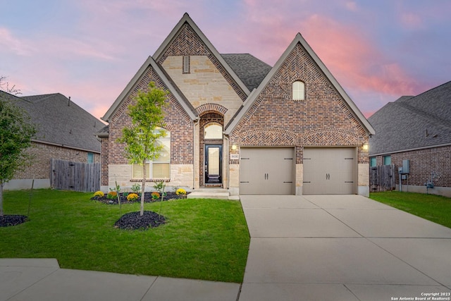 8826 Haystack Rd, San Antonio, TX 78254 - french country home with brick siding, concrete driveway, a garage, and stone siding
