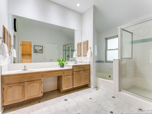 bathroom featuring lofted ceiling, double vanity, a shower stall, a bath, and recessed lighting