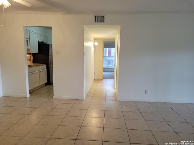 8702 Village Dr Unit 204, San Antonio, TX 78217 - empty room featuring light tile patterned floors, crown molding, a ceiling fan, and baseboards