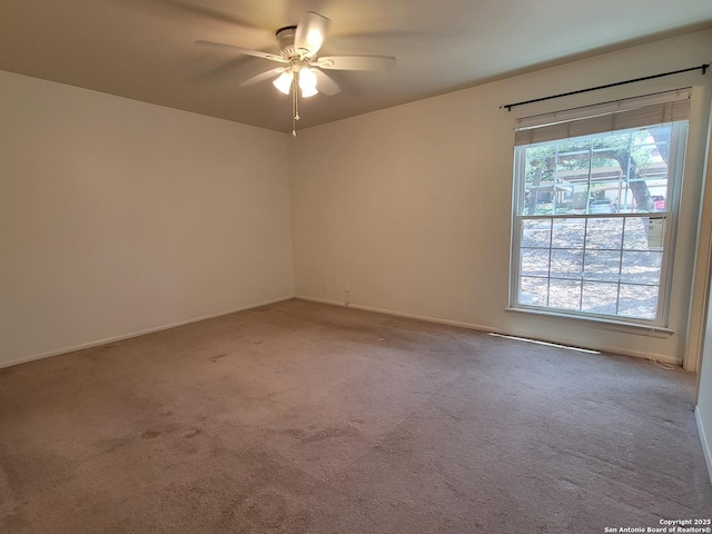 8702 Village Dr Unit 204, San Antonio, TX 78217 - carpeted spare room featuring a ceiling fan and baseboards