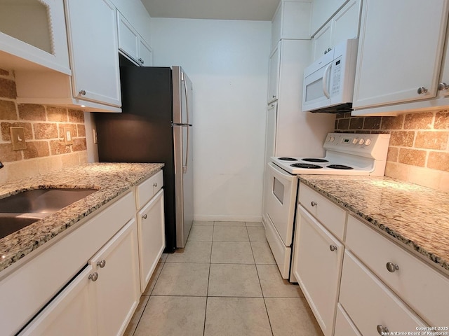 8702 Village Dr Unit 204, San Antonio, TX 78217 - kitchen with white appliances and white cabinets